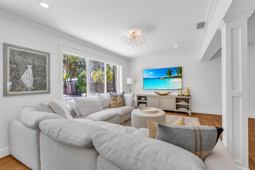 2800 Northeast 21st Avenue Lighthouse Point, FL 33064 - Photo 24 of 58 a living room with furniture and a large window
