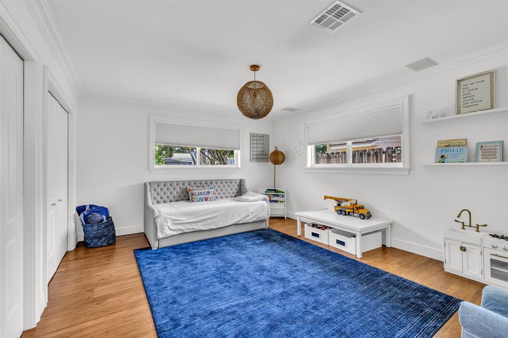 2800 Northeast 21st Avenue Lighthouse Point, FL 33064 - Photo 35 of 58 a bedroom with furniture and a rug