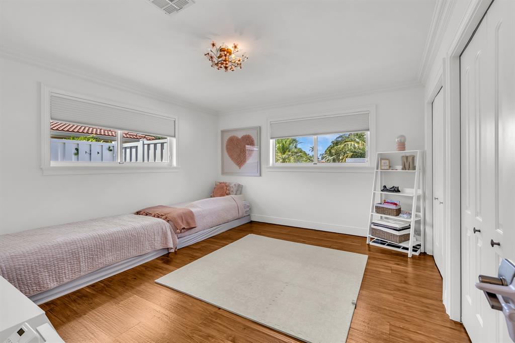 2800 Northeast 21st Avenue Lighthouse Point, FL 33064 - Photo 37 of 58 a bedroom with furniture and a window