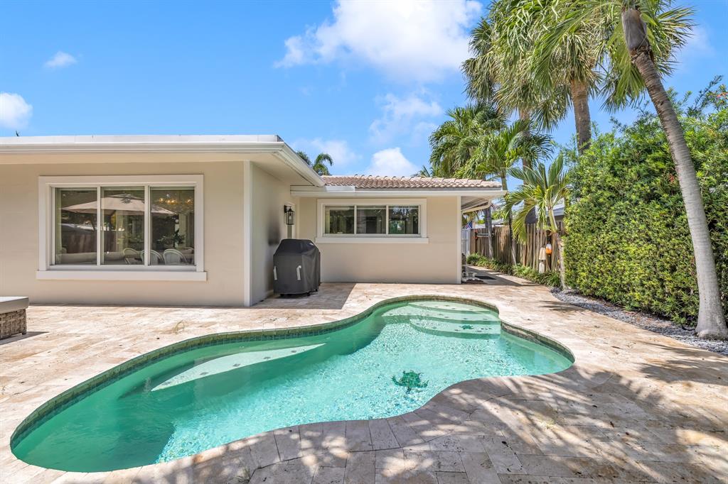 2800 Northeast 21st Avenue Lighthouse Point, FL 33064 - Photo 39 of 58 a front view of a house with a yard and garage