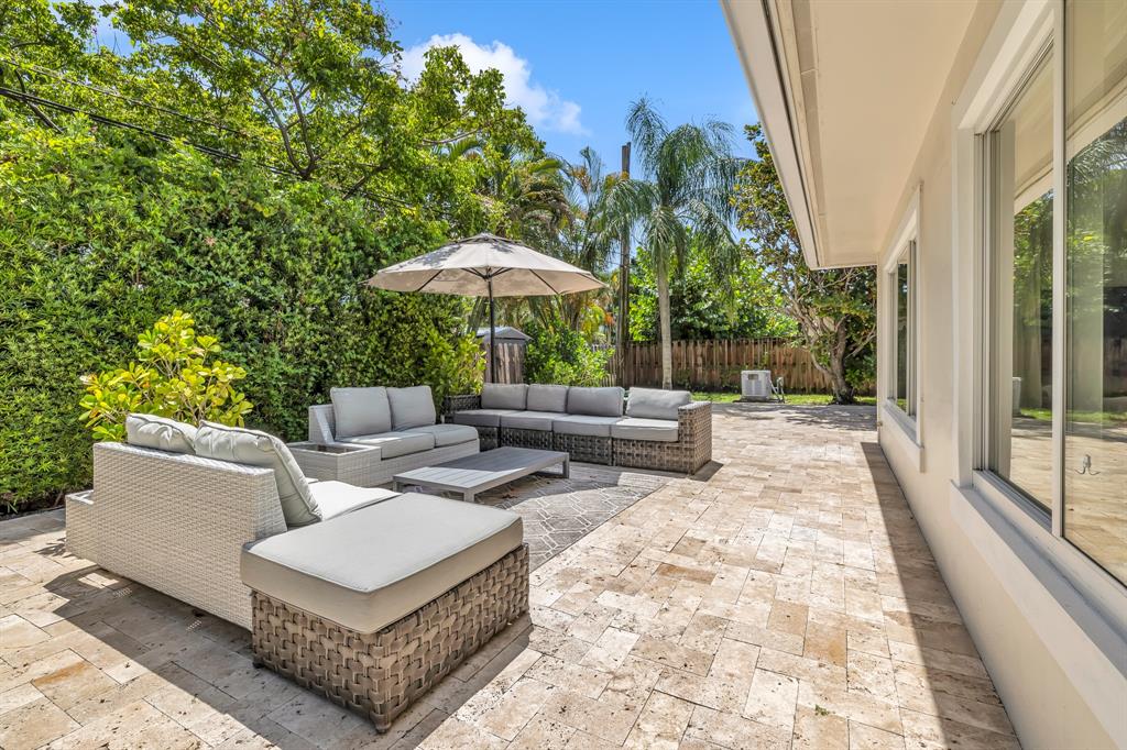 2800 Northeast 21st Avenue Lighthouse Point, FL 33064 - Photo 46 of 58 a view of backyard with outdoor seating and trees