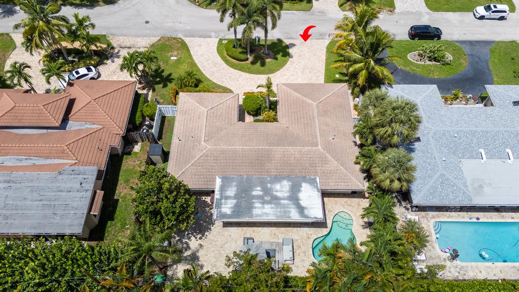 2800 Northeast 21st Avenue Lighthouse Point, FL 33064 - Photo 52 of 58 an aerial view of a house with a yard and garden