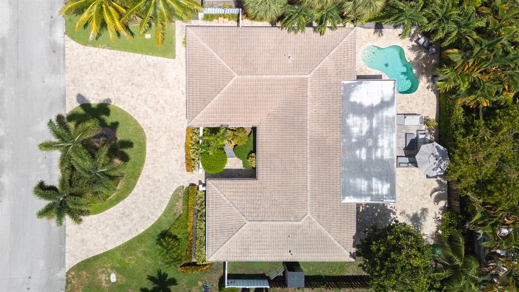 2800 Northeast 21st Avenue Lighthouse Point, FL 33064 - Photo 54 of 58 an aerial view of a house with a garden