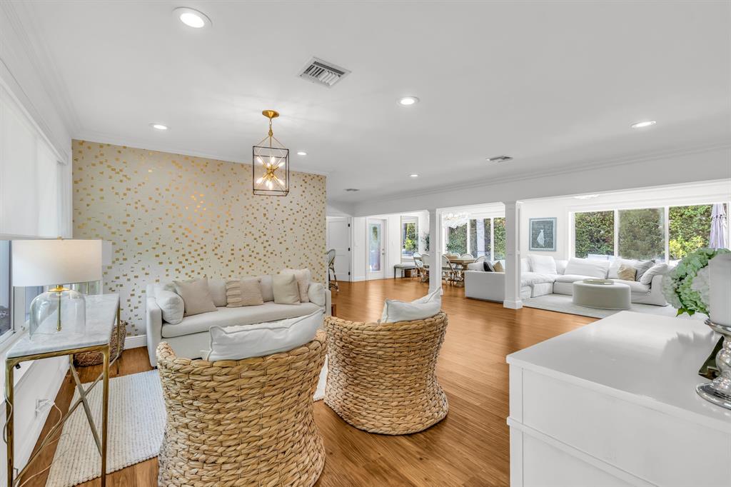 2800 Northeast 21st Avenue Lighthouse Point, FL 33064 - Photo 9 of 58 a living room with furniture and a chandelier
