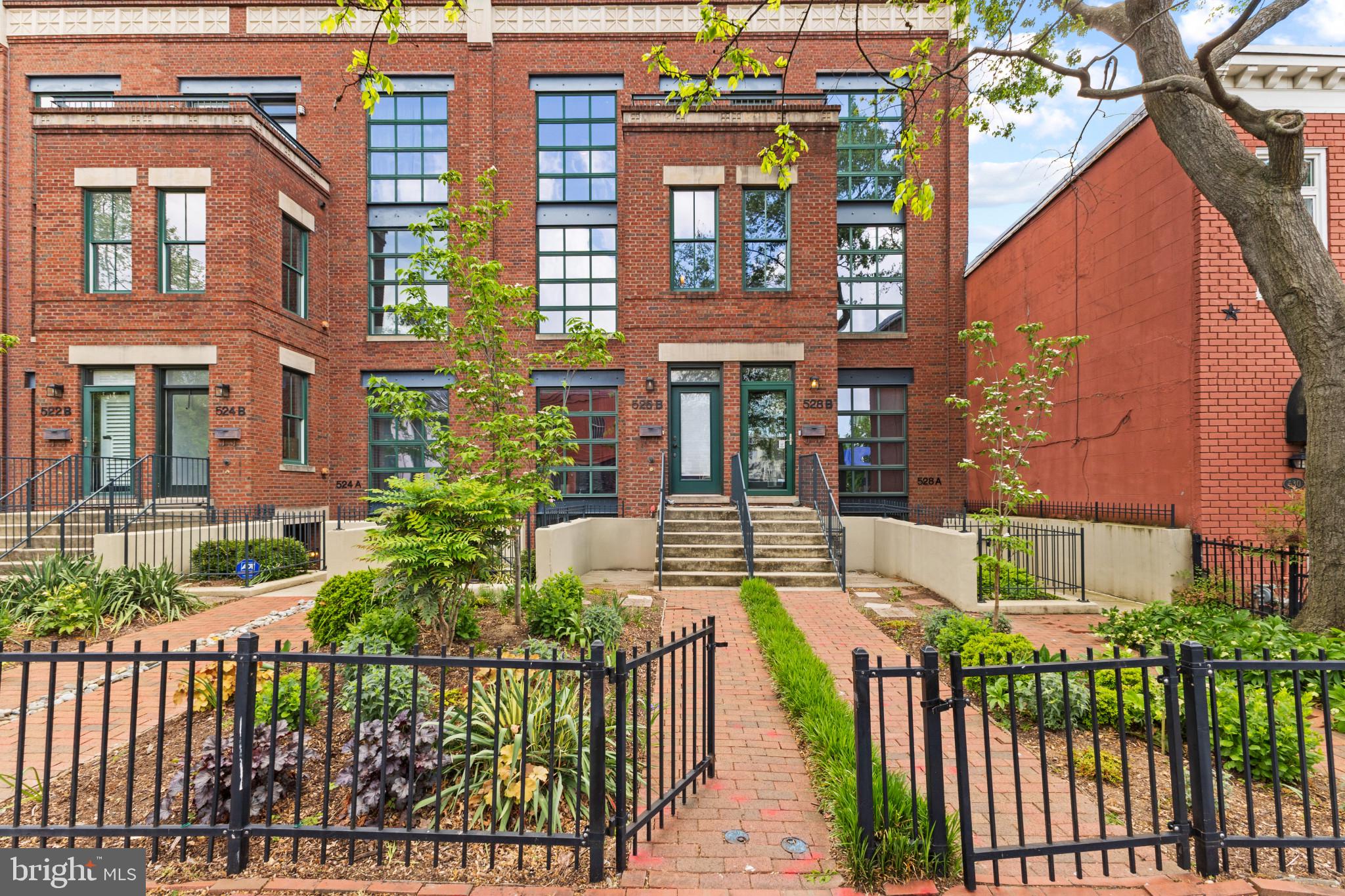 Charming brick townhomes with gardens.