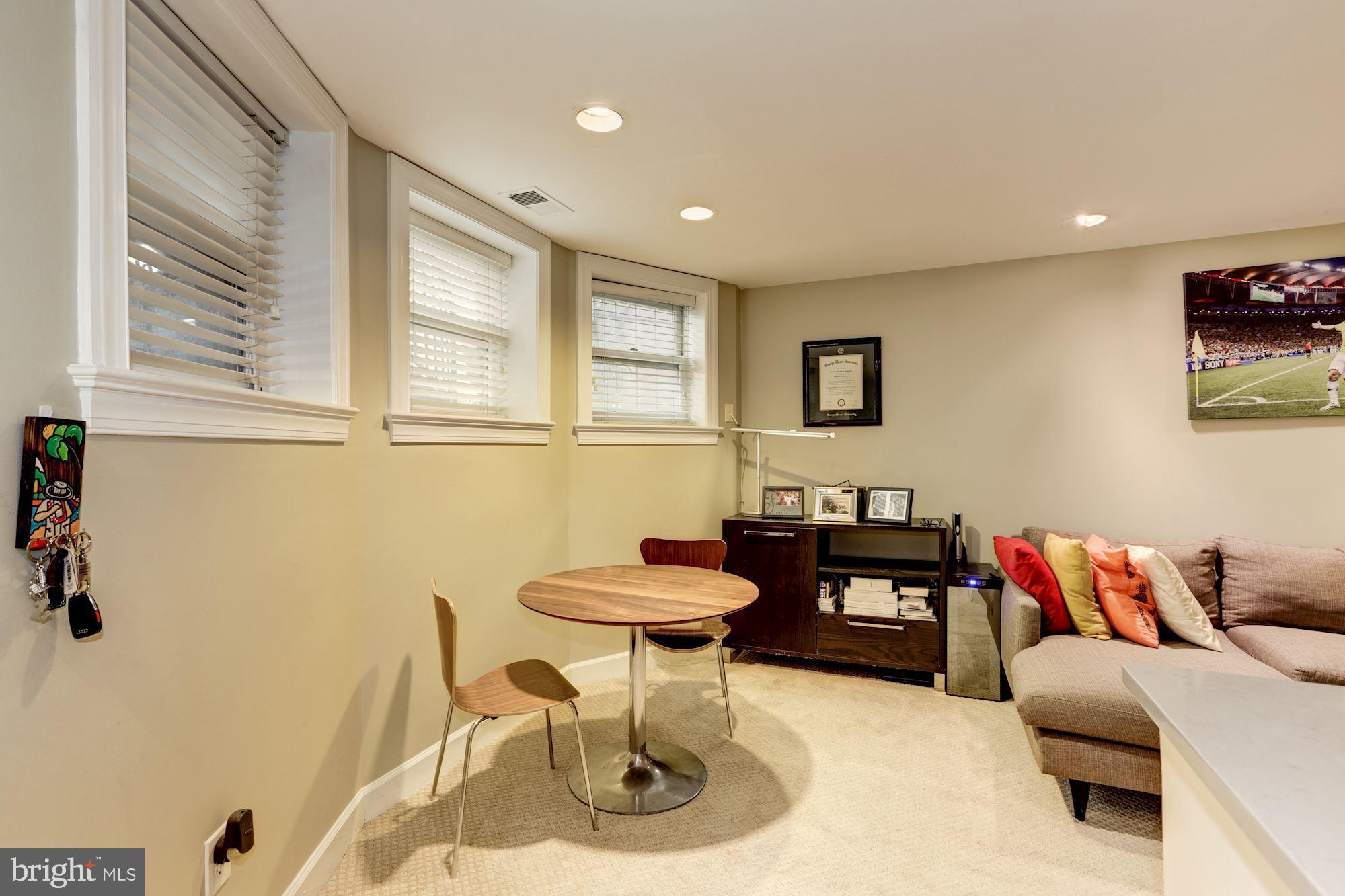 1630 19th Street Northwest, Unit B2 Washington, DC 20009 - Photo 6 of 19 a living room with furniture and a large window