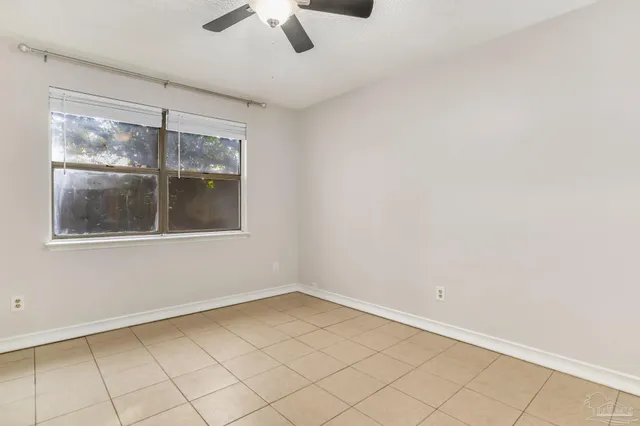 a view of empty room with windows