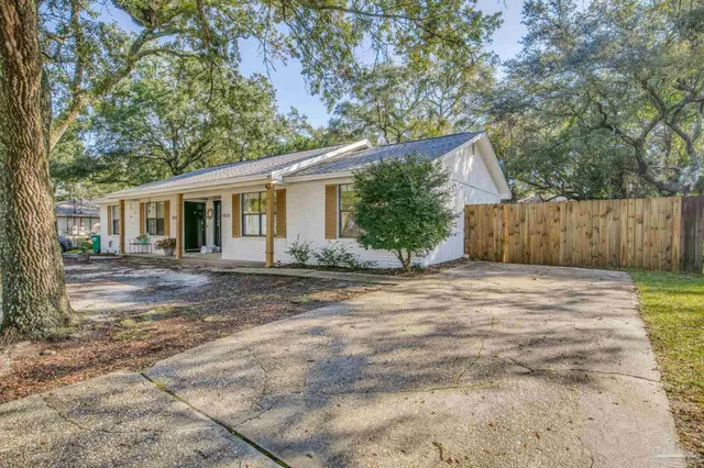 a front view of a house with a yard and a garage
