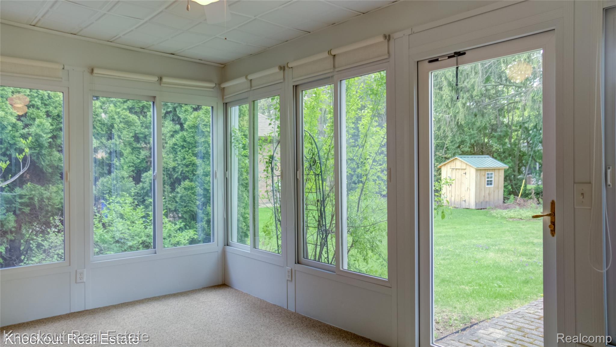 4465 Dirker Road Saginaw, MI 48638 - Photo 13 of 56 Sunroom featuring carpet floors