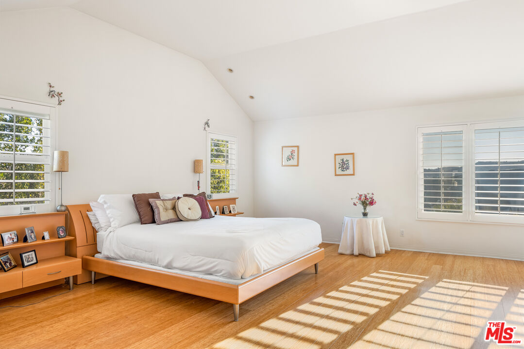 1641 Stradella Road Los Angeles, CA 90077 - Photo 17 of 23 a bedroom with a bed and a window