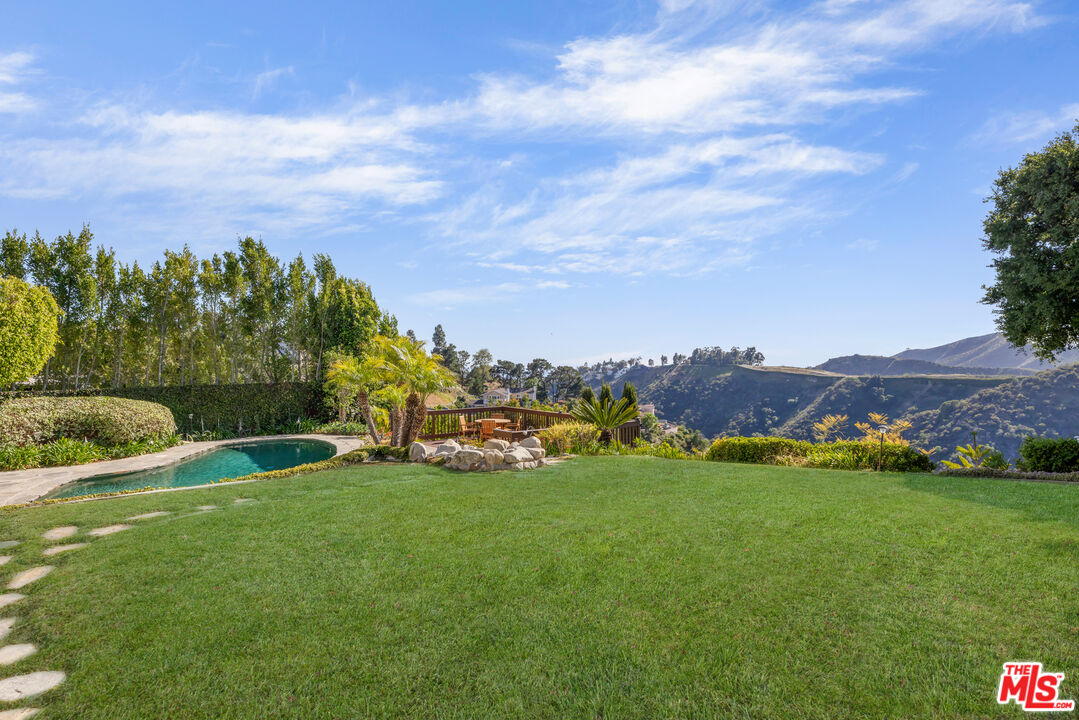 1641 Stradella Road Los Angeles, CA 90077 - Photo 4 of 23 a view of an outdoor space and a yard