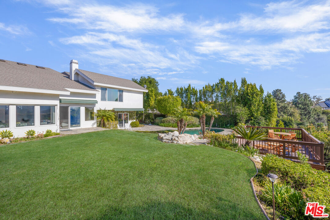 1641 Stradella Road Los Angeles, CA 90077 - Photo 5 of 23 a front view of house with a garden