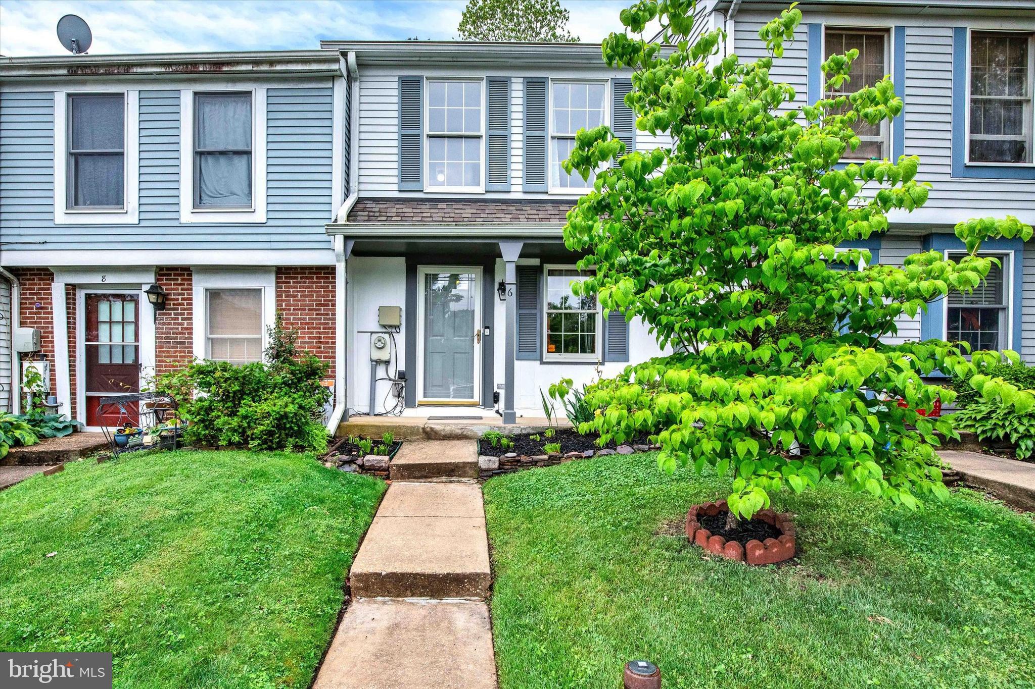 6 Stillwood Circle Nottingham, MD 21236 - Photo 1 of 21 a front view of a house with a yard and potted plants