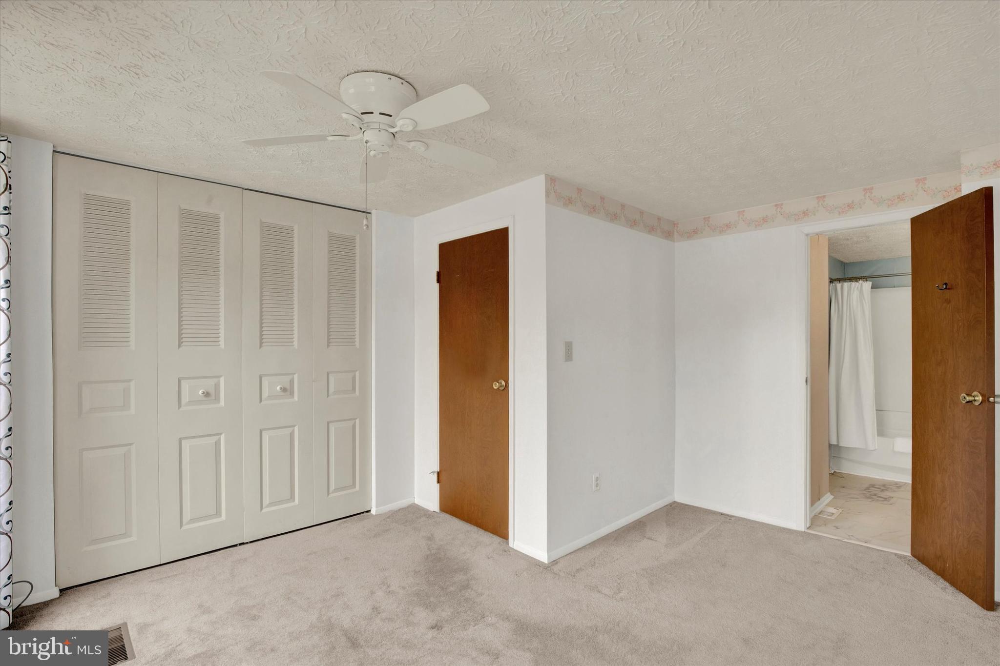 6 Stillwood Circle Nottingham, MD 21236 - Photo 13 of 21 an empty room with a ceiling fan