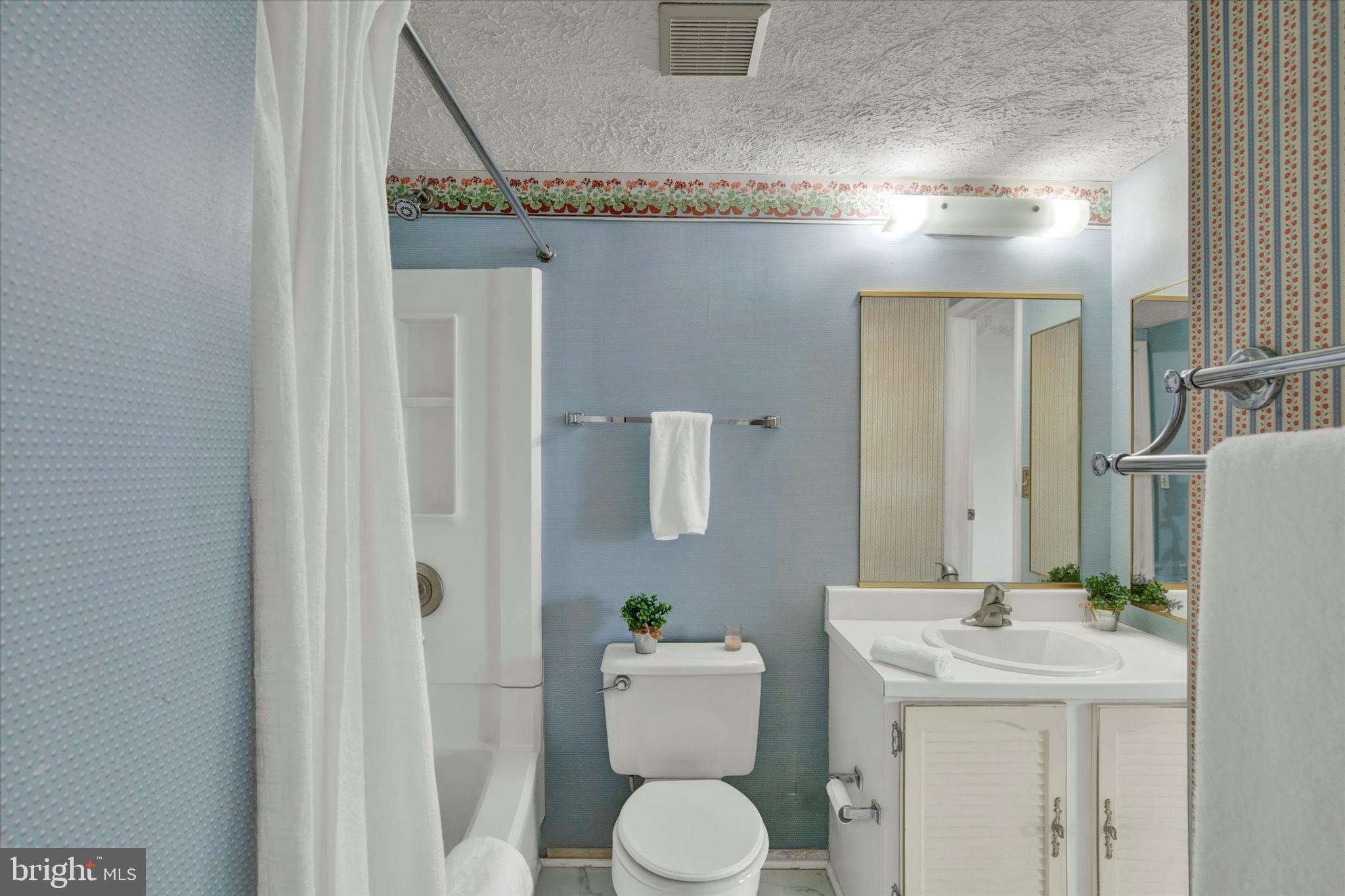 6 Stillwood Circle Nottingham, MD 21236 - Photo 14 of 21 a bathroom with a toilet a sink and mirror