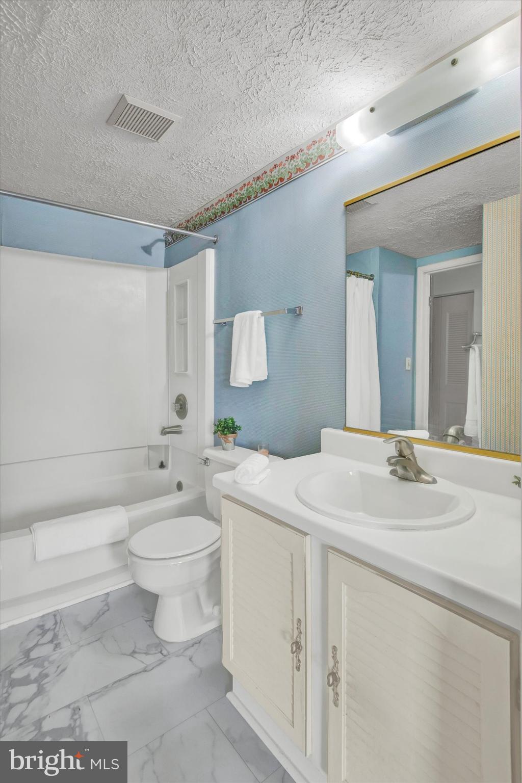 6 Stillwood Circle Nottingham, MD 21236 - Photo 15 of 21 a bath room with a toilet a sink and a mirror