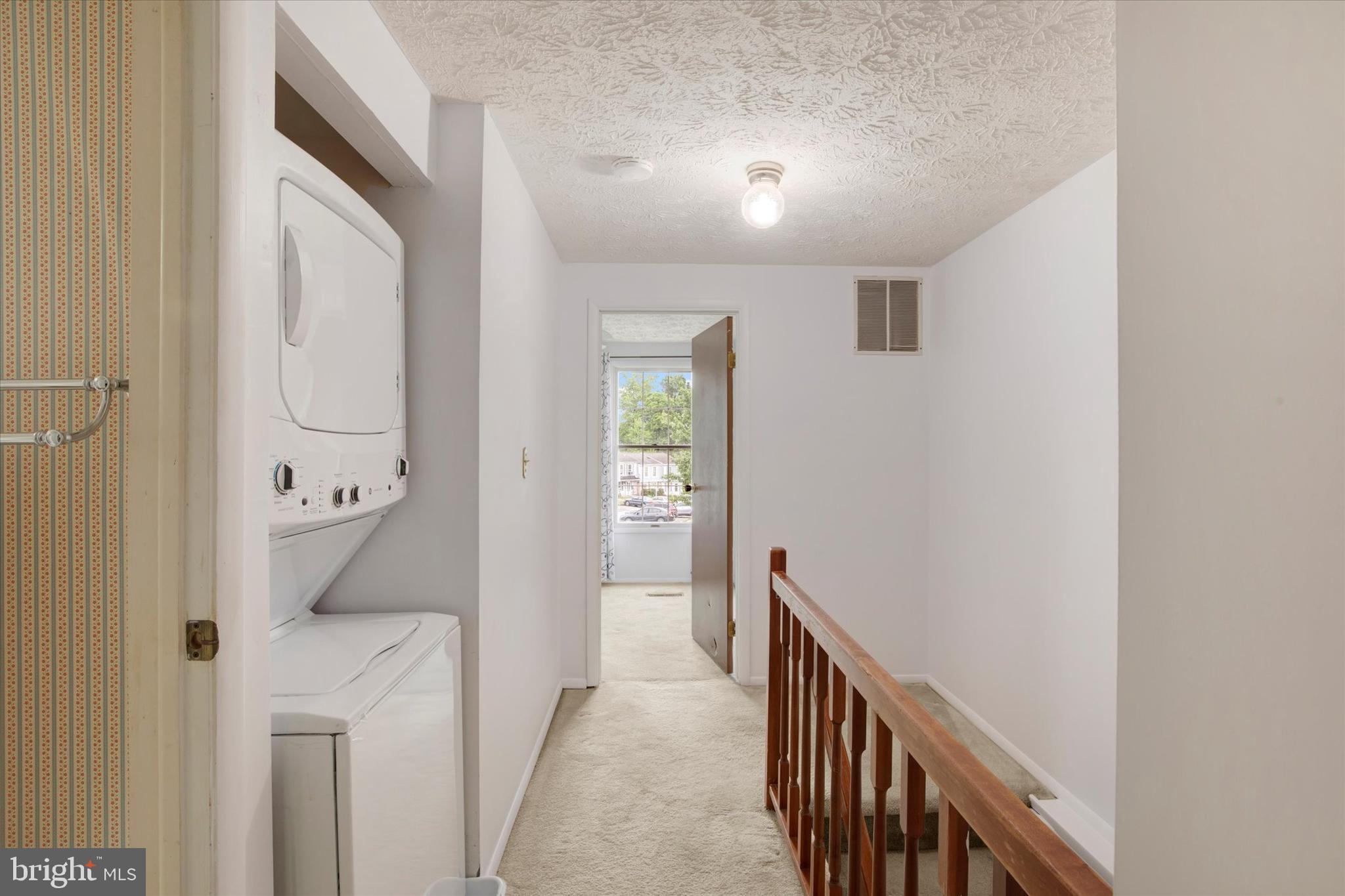 6 Stillwood Circle Nottingham, MD 21236 - Photo 19 of 21 a view of a hallway with wooden floor and staircase