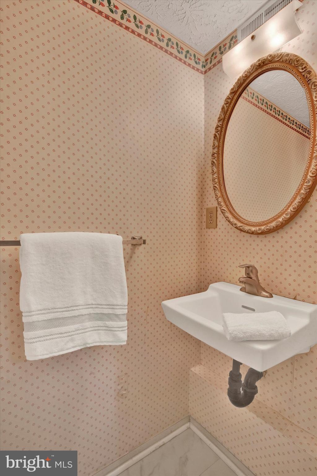 6 Stillwood Circle Nottingham, MD 21236 - Photo 10 of 21 a bathroom with a sink and a mirror