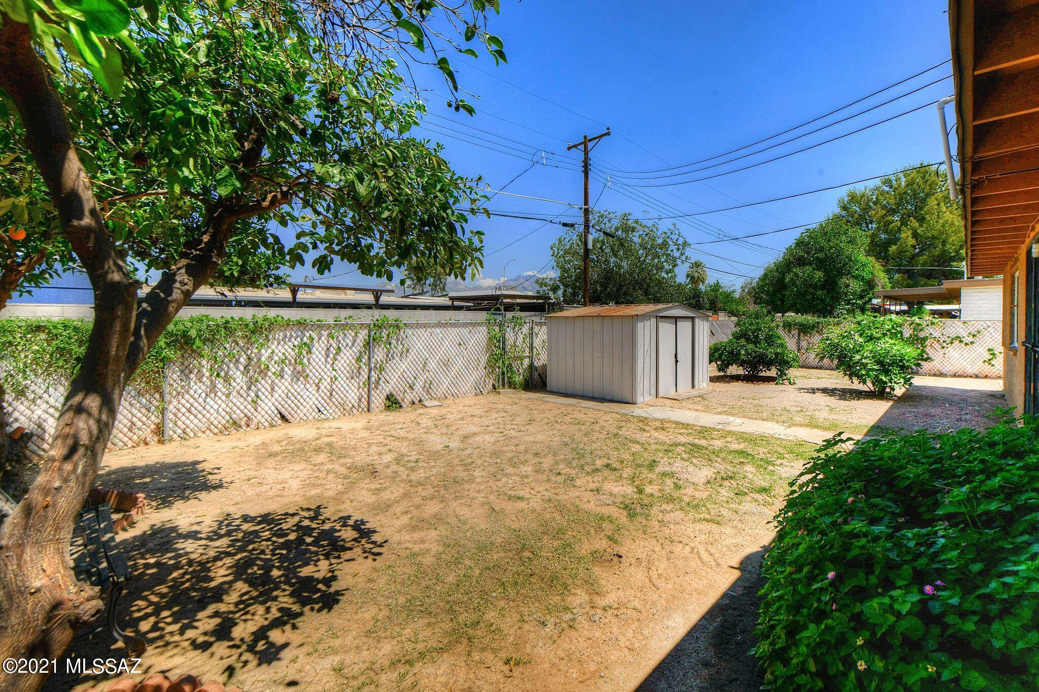 1470 West Roger Road Tucson, AZ 85705 - Photo 18 of 18 a view of a backyard of the house