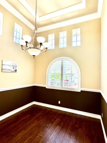 a view of a living room and hardwood floor