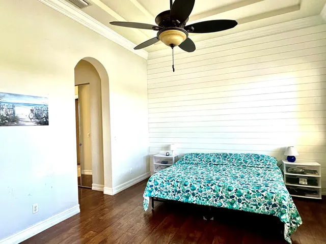 a bedroom with a bed and a table