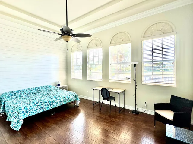 a bedroom with furniture and a window