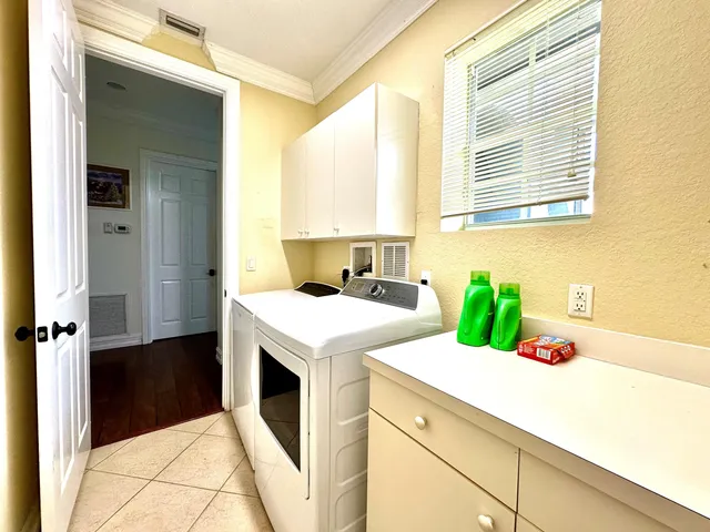 a kitchen with a stove a sink and a refrigerator