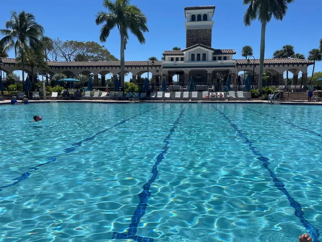 a front view of house with yard and swimming pool