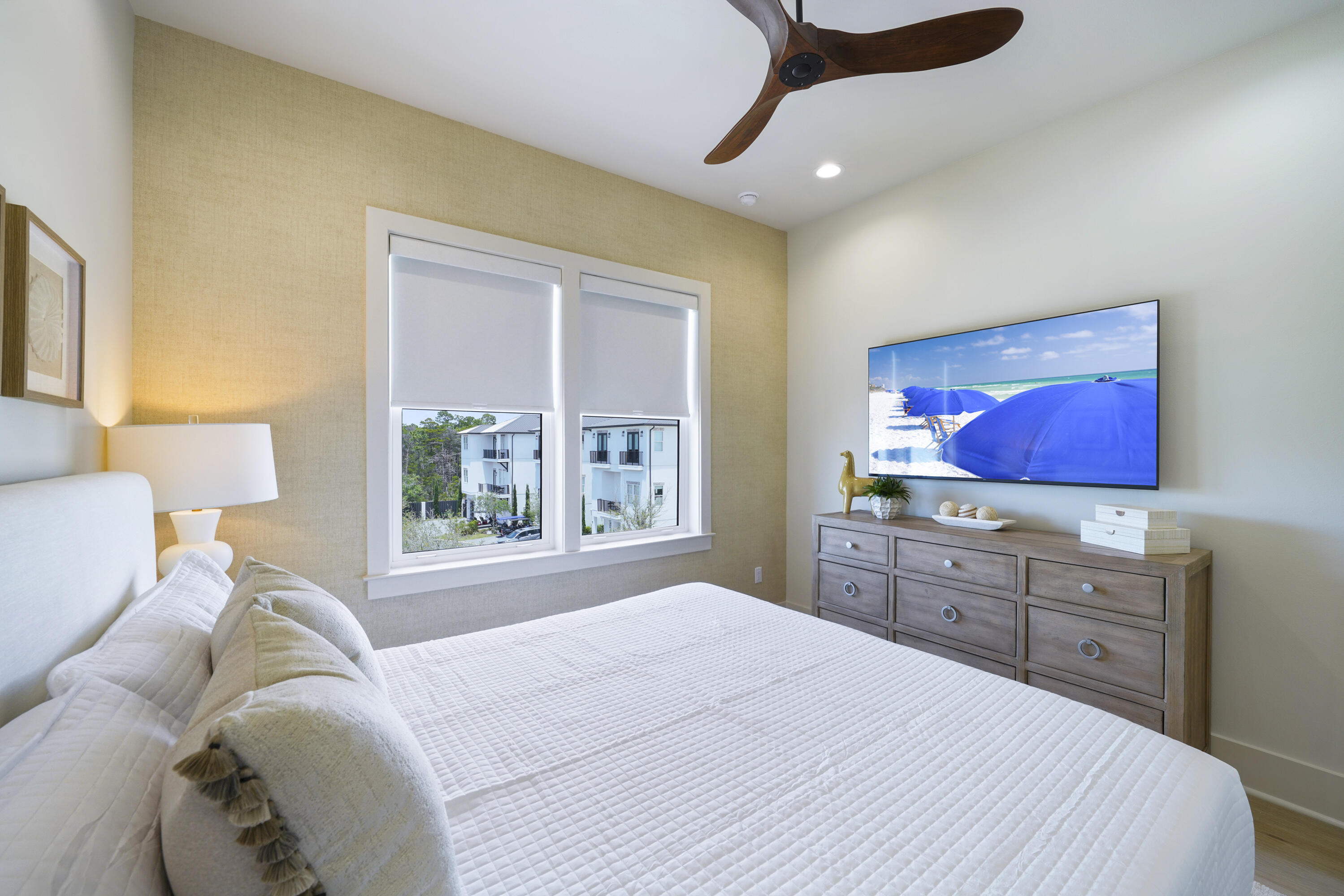 56 Sea Croft Cove Santa Rosa Beach, FL 32459 - Photo 45 of 65 a bedroom with a large bed and a flat screen tv