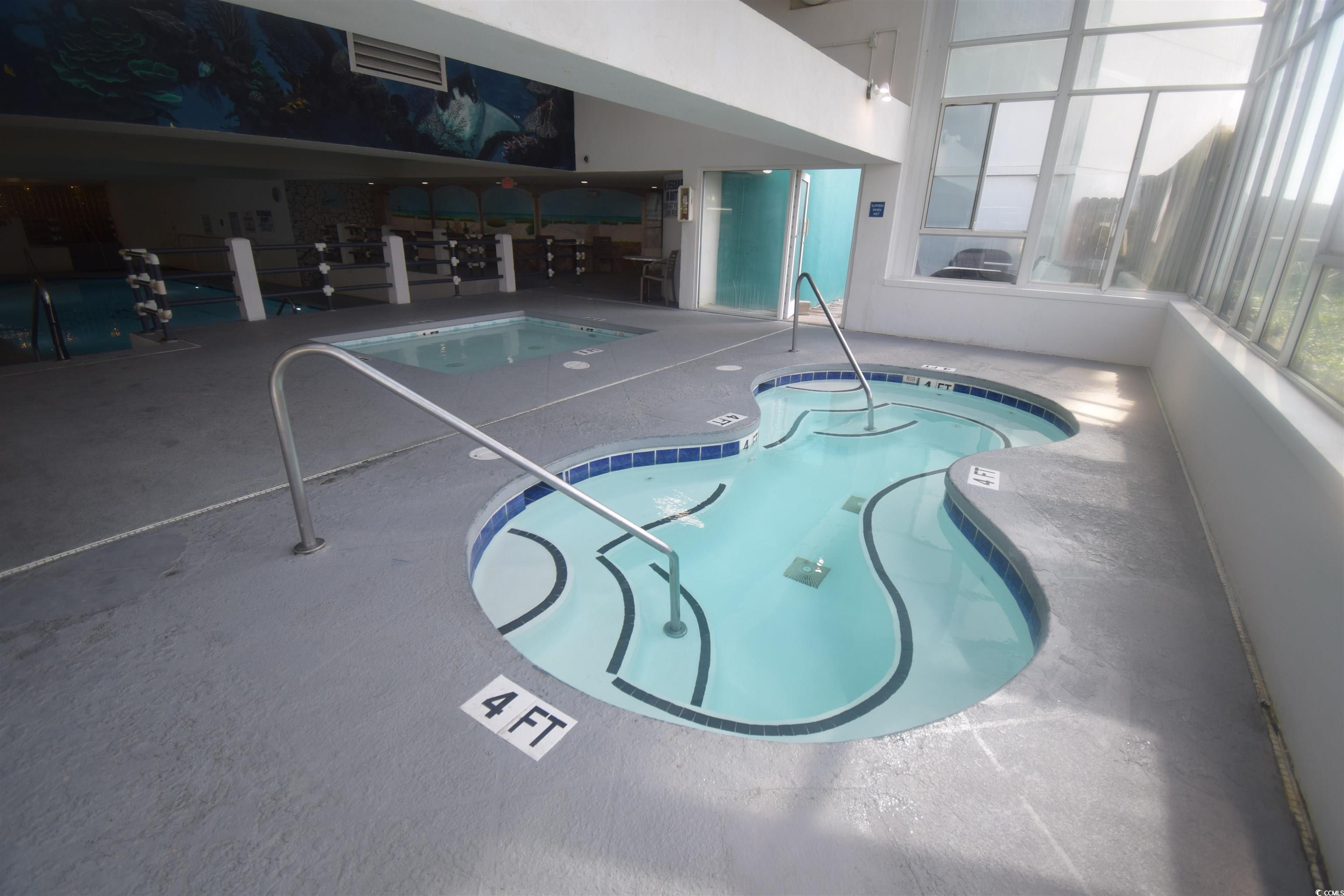 1210 North Waccamaw Drive, Unit 1102 Murrells Inlet, SC 29576 - Photo 40 of 40 Community pool with a hot tub