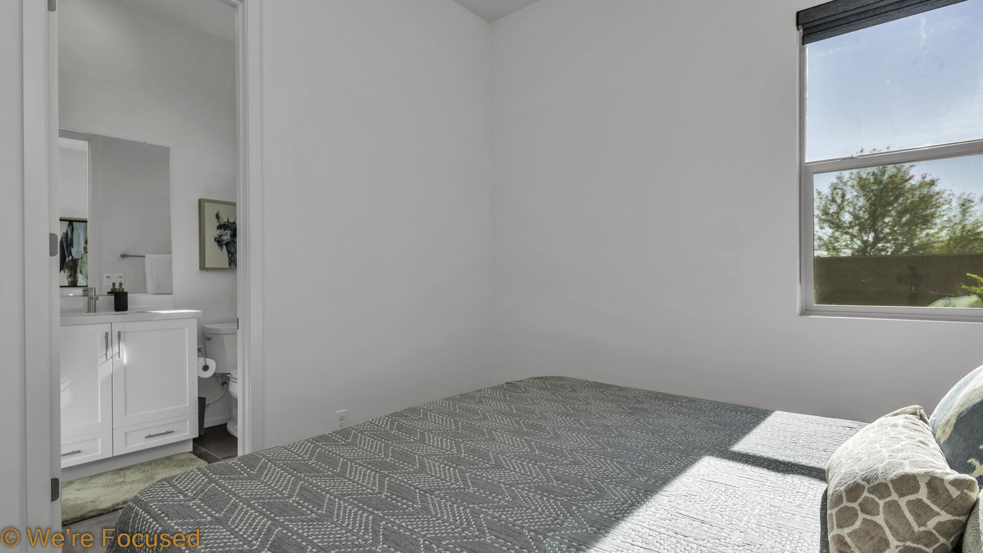 50845 Bee Canyon Drive Indio, CA 92201 - Photo 11 of 74 a view of a bedroom with a bed and a window