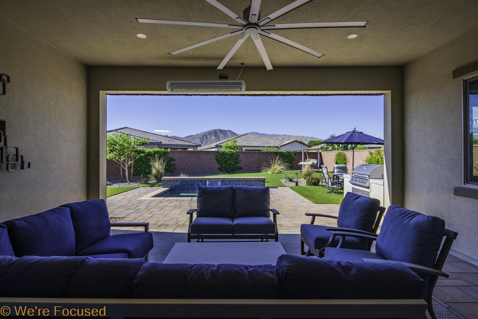 50845 Bee Canyon Drive Indio, CA 92201 - Photo 33 of 74 a living room with furniture and a fireplace