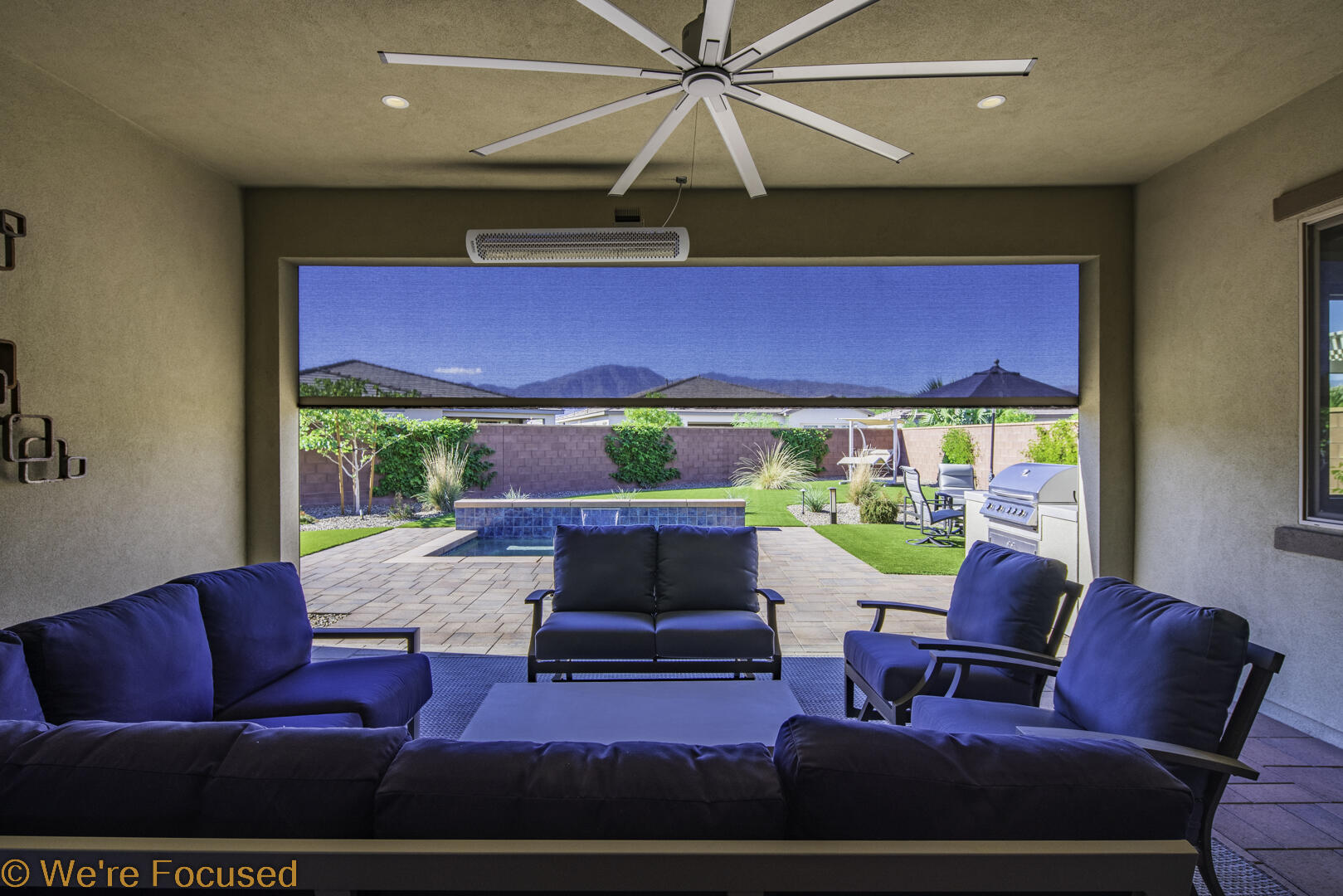 50845 Bee Canyon Drive Indio, CA 92201 - Photo 35 of 74 a living room with furniture and a potted plant