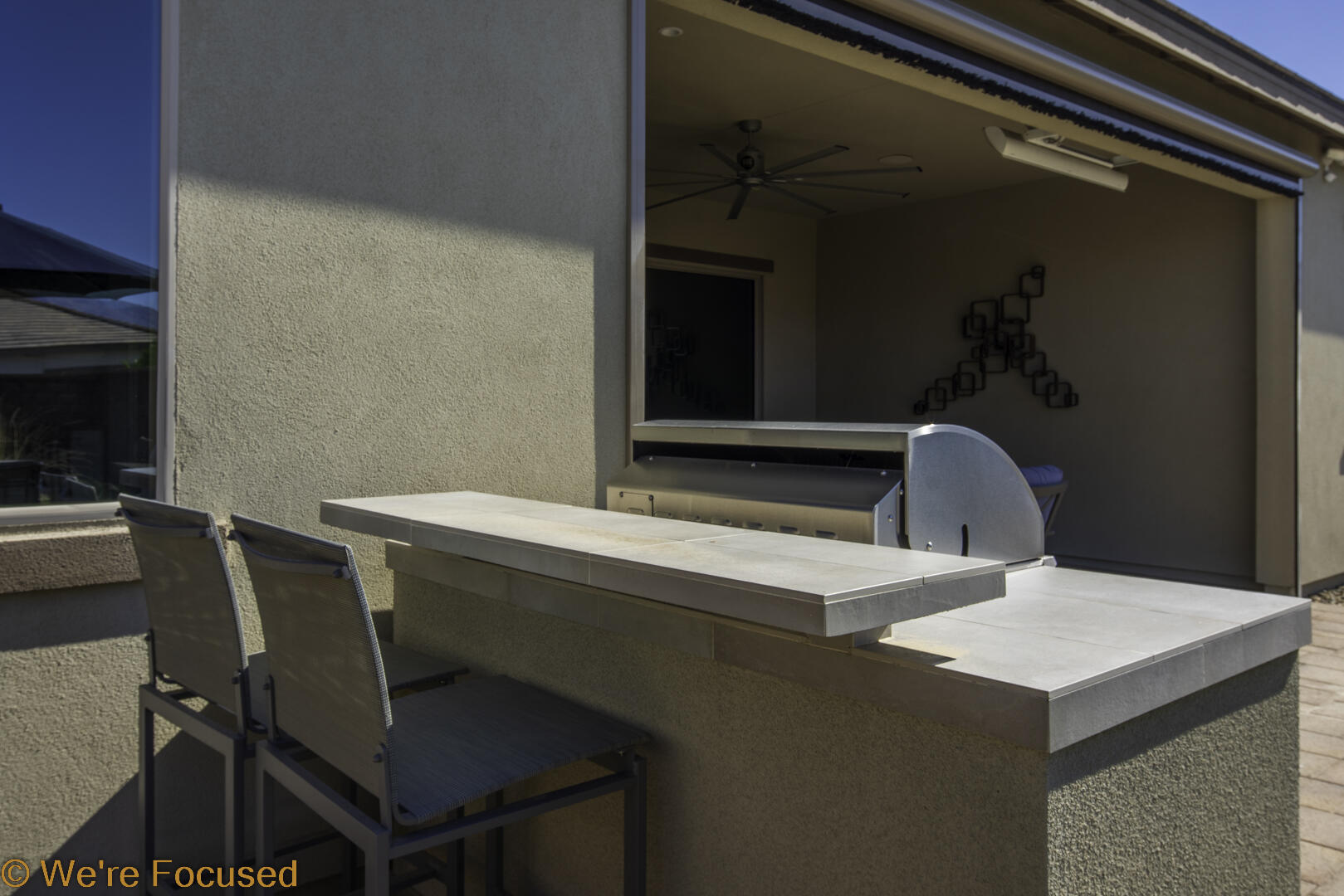 50845 Bee Canyon Drive Indio, CA 92201 - Photo 38 of 74 a room with a table chairs and wooden floor