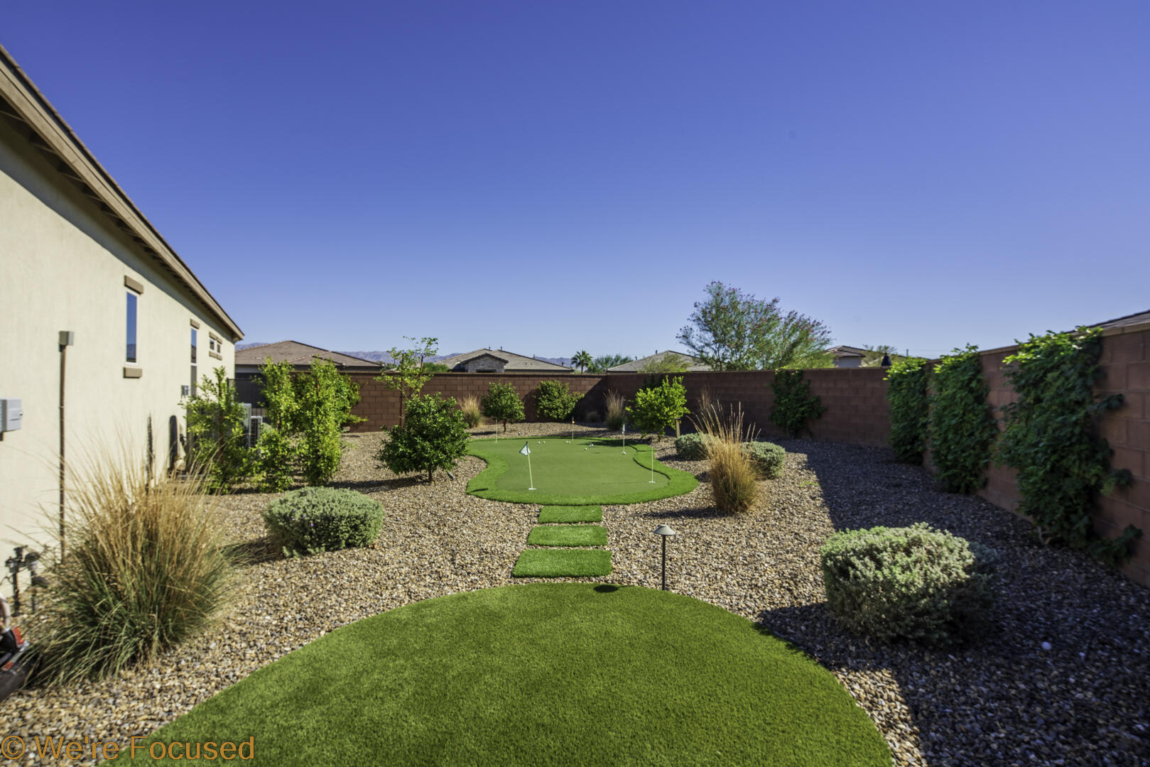50845 Bee Canyon Drive Indio, CA 92201 - Photo 44 of 74 a view of a garden with a building in the background