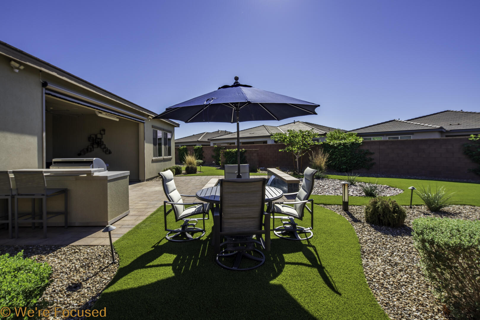 50845 Bee Canyon Drive Indio, CA 92201 - Photo 47 of 74 a view of a patio with table and chairs under an umbrella