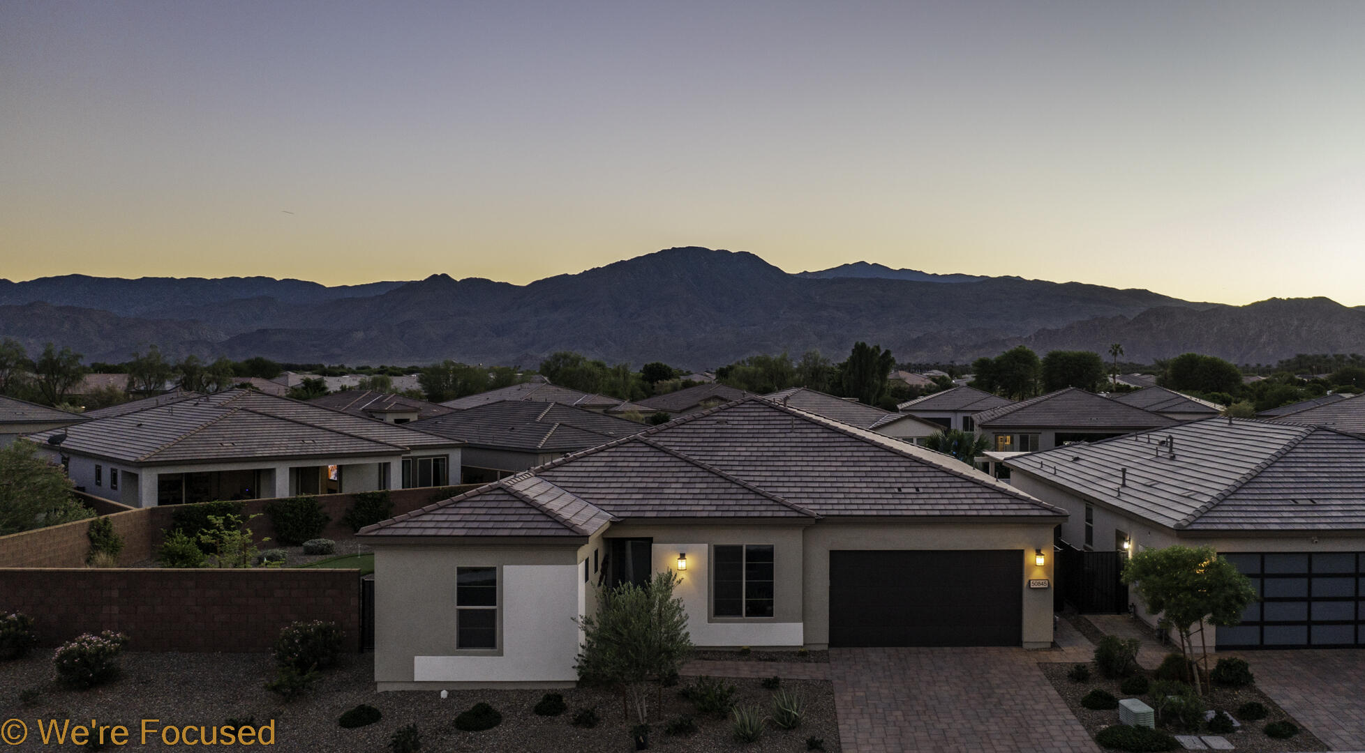 50845 Bee Canyon Drive Indio, CA 92201 - Photo 52 of 74 a front view of a house with a garden