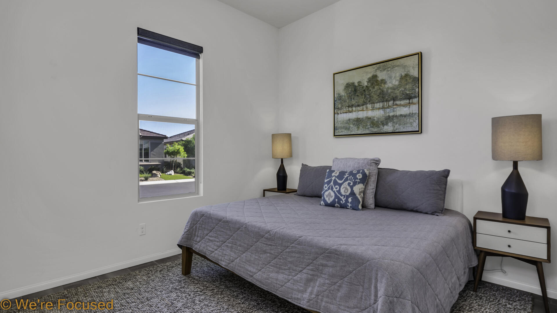 50845 Bee Canyon Drive Indio, CA 92201 - Photo 7 of 74 a bedroom with a bed and a painting on the wall
