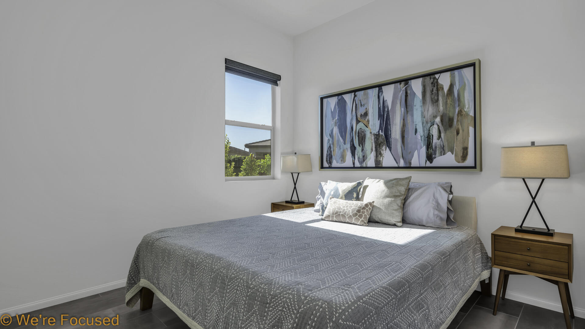 50845 Bee Canyon Drive Indio, CA 92201 - Photo 10 of 74 a bedroom with a bed and a lamp with the wooden floor