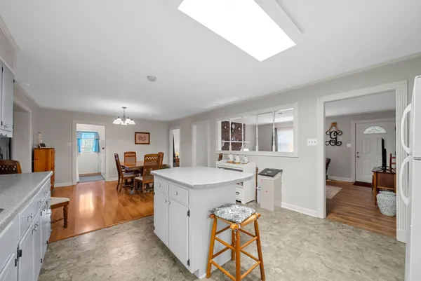 a view of a dining room with furniture and a livingroom