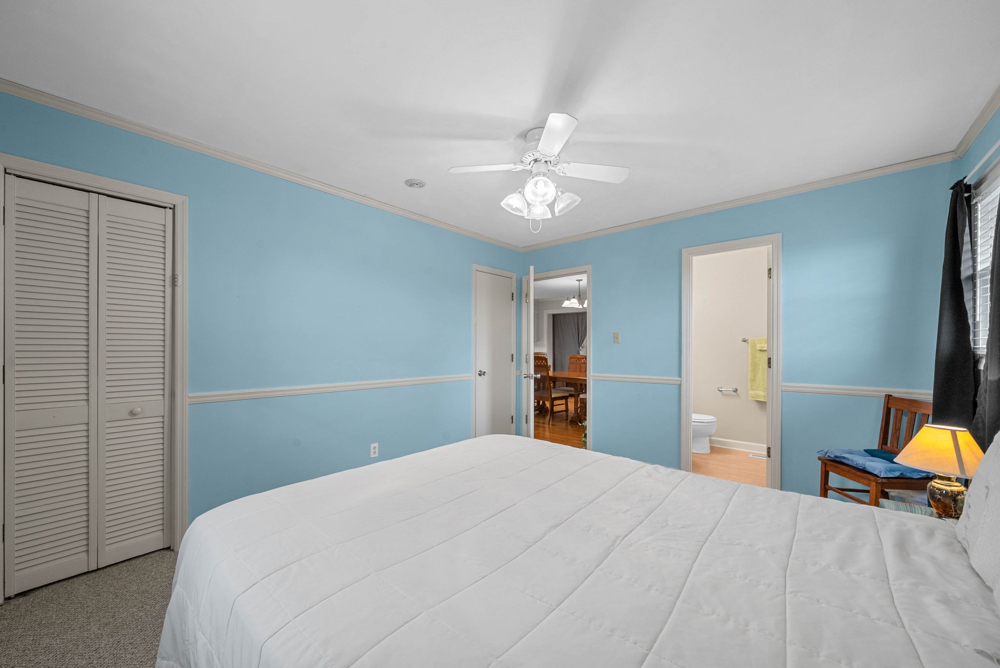 5675 Princeton Road Hopkinsville, KY 42240 - Photo 19 of 38 a bedroom with a bed and a chandelier