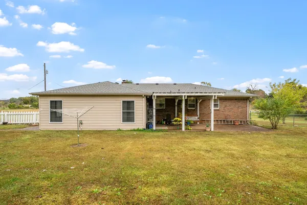 a view of a field with an trees