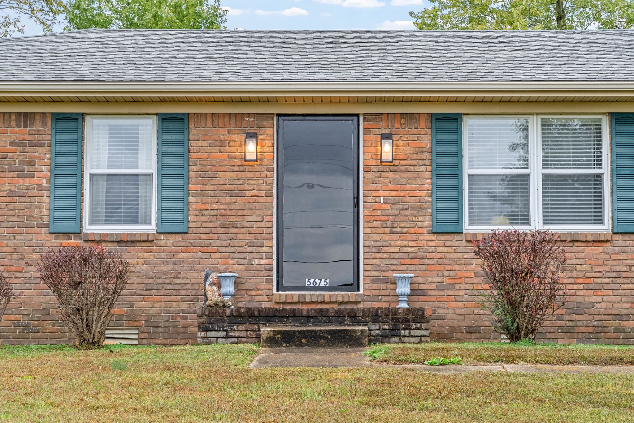 5675 Princeton Road Hopkinsville, KY 42240 - Photo 5 of 38 a front view of a house with a yard
