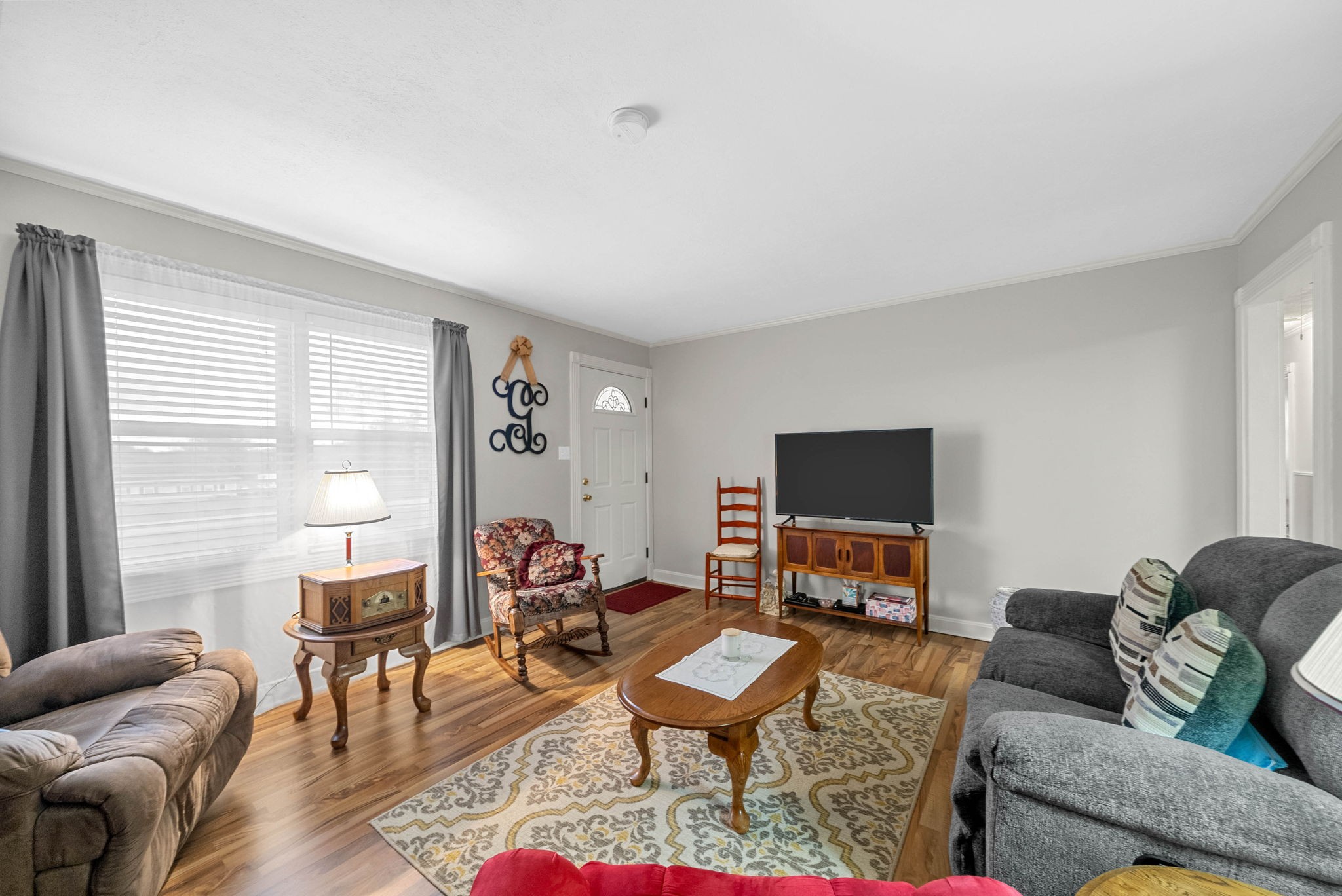 5675 Princeton Road Hopkinsville, KY 42240 - Photo 8 of 38 a living room with furniture and a flat screen tv