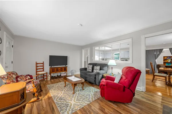 a living room with furniture or couch and a flat screen tv