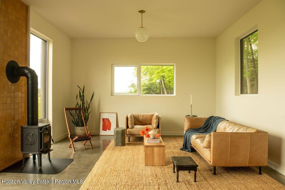 346 Cold Spring Road Hudson, NY 12534 - Photo 5 of 25 a living room with furniture and a window