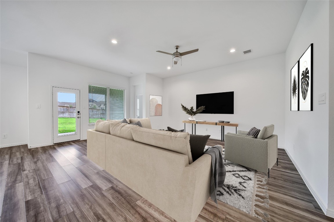 906 Youth Water Road Montgomery, TX 77316 - Photo 20 of 42 a living room with furniture and a flat screen tv