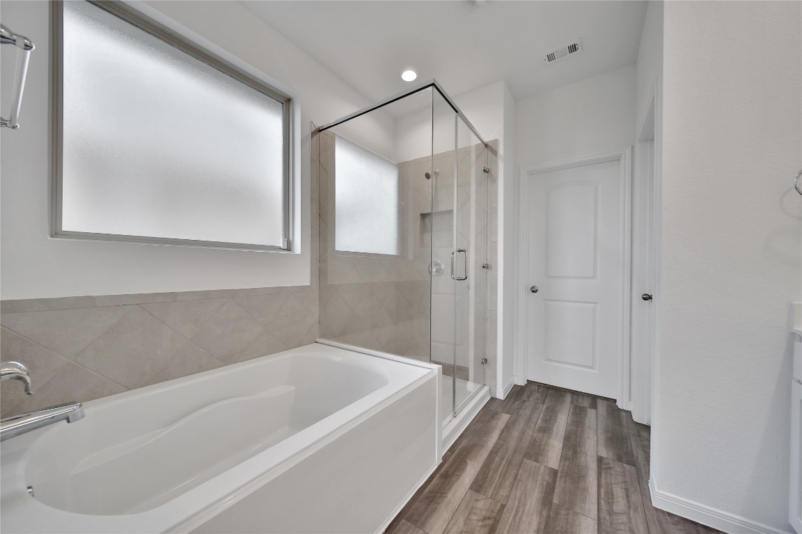 906 Youth Water Road Montgomery, TX 77316 - Photo 23 of 42 a bathroom with a bathtub and a shower