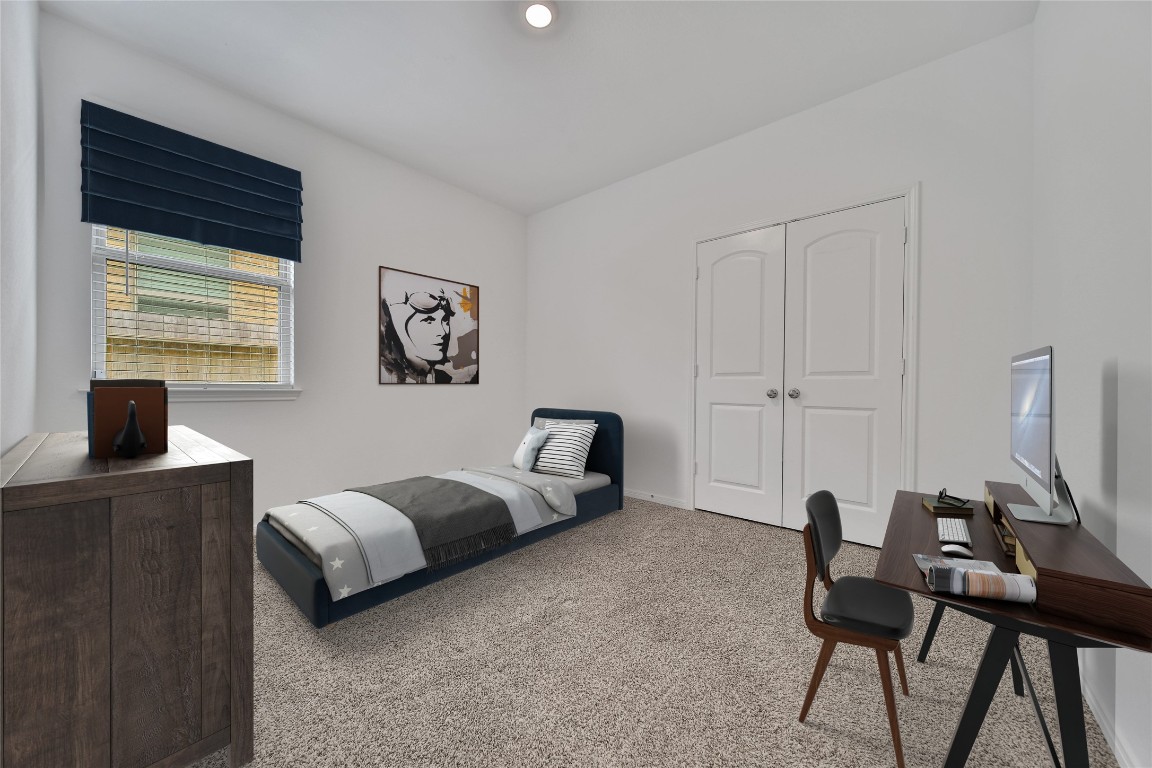 906 Youth Water Road Montgomery, TX 77316 - Photo 28 of 42 a bedroom with a bed and a desk