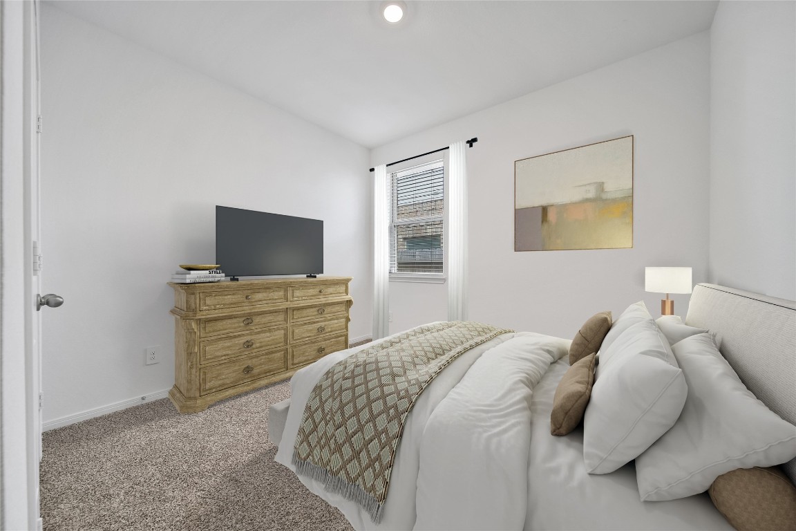 906 Youth Water Road Montgomery, TX 77316 - Photo 29 of 42 a bedroom with a bed and a television in it